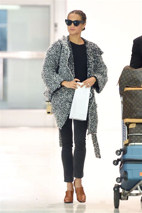 Alicia Vikander Steps Up Her Airport Style in the Heeled Loafer